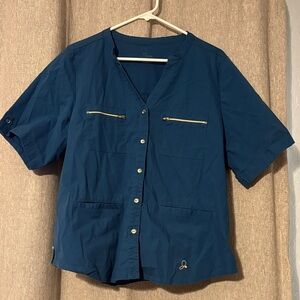 Jaanuu Blue Button Down 4 pocket scrub top with gold accents